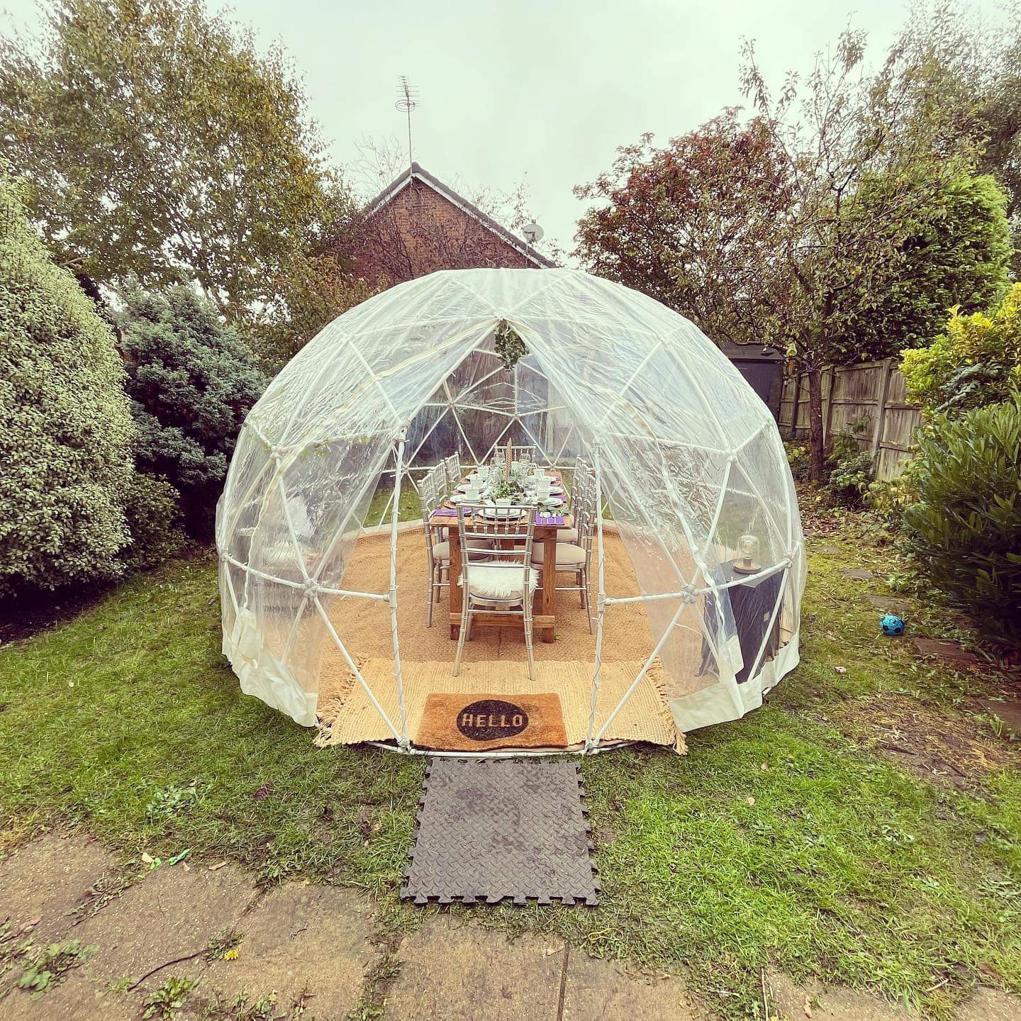 Group of girls enjoying birthday sleepover inside igloo